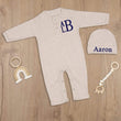Load image into Gallery viewer, Beige newborn coming home outfit with a stacked monogram
