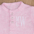 Load image into Gallery viewer, Newborn girl pink take home outfit: close-up of the monogram
